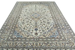 Surface texture of 2000s Kashan rug with natural Wool and intricate pattern