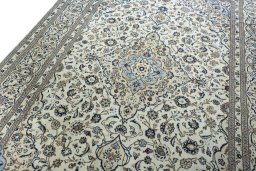 Backside of handmade 2000s Kashan rug showing knot structure and weave density