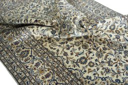 Surface texture of 2000s Kashan rug with natural Wool and intricate pattern