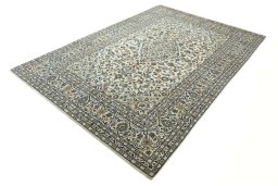 Corner detail of 2000s Kashan rug showing border pattern and Wool pile