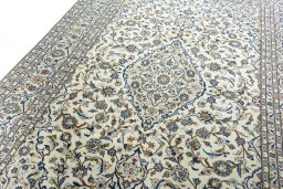 Backside of handmade 2000s Kashan rug showing knot structure and weave density