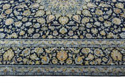 Corner detail of 2000s Kashan rug showing border pattern and Wool pile