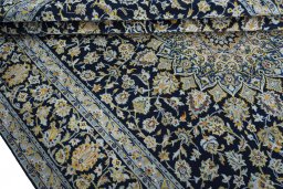 Close-up detail of 2000s Kashan rug from Iran / Persia showing Wool weave