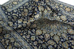 Surface texture of 2000s Kashan rug with natural Wool and intricate pattern