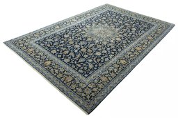 Corner detail of 2000s Kashan rug showing border pattern and Wool pile