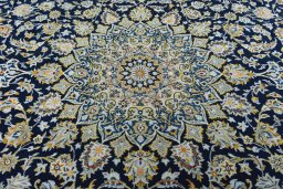 Central medallion detail of 2000s Kashan rug from Iran / Persia
