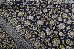 Close-up detail of 2000s Kashan rug from Iran / Persia showing Wool weave