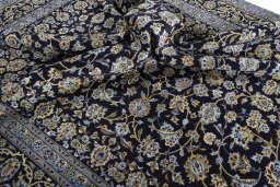 Surface texture of 2000s Kashan rug with natural Wool and intricate pattern