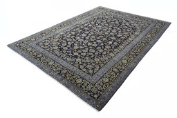 Corner detail of 2000s Kashan rug showing border pattern and Wool pile