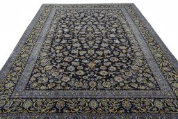 Surface texture of 2000s Kashan rug with natural Wool and intricate pattern