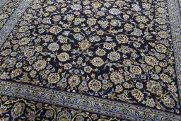 Close-up detail of 2000s Kashan rug from Iran / Persia showing Wool weave