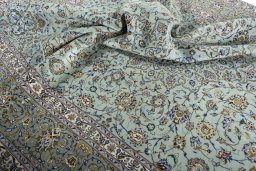 Surface texture of 2000s Kashan rug with natural Wool and intricate pattern