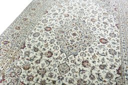 Backside of handmade 2000s Kashan rug showing knot structure and weave density
