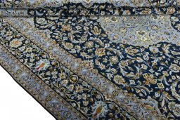 Close-up detail of 2000s Kashan rug from Iran / Persia showing Wool weave