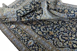 Surface texture of 2000s Kashan rug with natural Wool and intricate pattern