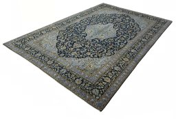 Corner detail of 2000s Kashan rug showing border pattern and Wool pile