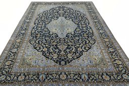 Surface texture of 2000s Kashan rug with natural Wool and intricate pattern