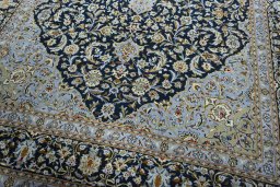 Close-up detail of 2000s Kashan rug from Iran / Persia showing Wool weave