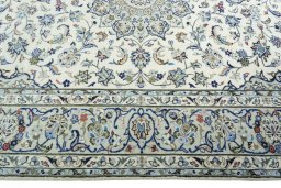 Corner detail of New Kashan rug showing border pattern and Wool pile