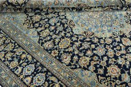 Close-up detail of 2000s Kashan rug from Iran / Persia showing Wool weave