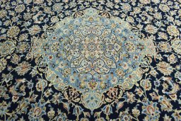 Central medallion detail of 2000s Kashan rug from Iran / Persia