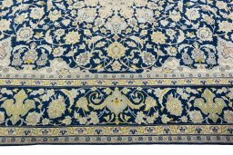 Corner detail of 2000s Kashan rug showing border pattern and Wool pile