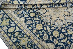 Close-up detail of 2000s Kashan rug from Iran / Persia showing Wool weave
