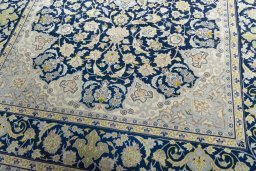 Close-up detail of 2000s Kashan rug from Iran / Persia showing Wool weave