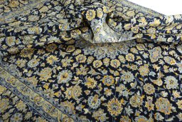 Surface texture of 2000s Kashan rug with natural Wool and intricate pattern