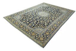 Corner detail of 2000s Kashan rug showing border pattern and Wool pile