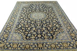 Surface texture of 2000s Kashan rug with natural Wool and intricate pattern