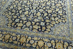 Close-up detail of 2000s Kashan rug from Iran / Persia showing Wool weave