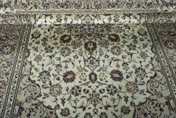 Close-up detail of 2000s Kashan rug from Iran / Persia showing Wool weave
