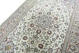 Backside of handmade 2000s Kashan rug showing knot structure and weave density