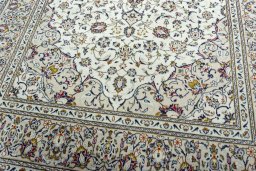 Close-up detail of 2000s Kashan rug from Iran / Persia showing Wool weave