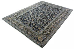 Corner detail of 2000s Kashan rug showing border pattern and Wool pile