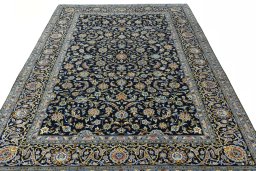 Surface texture of 2000s Kashan rug with natural Wool and intricate pattern
