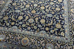 Close-up detail of 2000s Kashan rug from Iran / Persia showing Wool weave