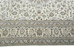 Corner detail of New Kashan rug showing border pattern and Wool pile