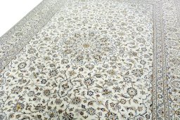Backside of handmade New Kashan rug showing knot structure and weave density