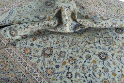 Surface texture of 2000s Kashan rug with natural Wool and intricate pattern