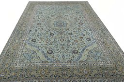 Surface texture of 2000s Kashan rug with natural Wool and intricate pattern