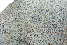Backside of handmade 2000s Kashan rug showing knot structure and weave density