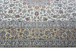 Corner detail of 2000s Kashan rug showing border pattern and Wool pile