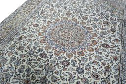 Backside of handmade 2000s Kashan rug showing knot structure and weave density
