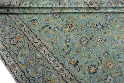 Close-up detail of 2000s Kashan rug from Iran / Persia showing Wool weave