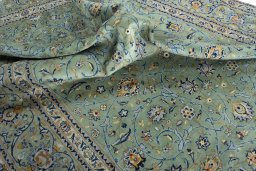 Surface texture of 2000s Kashan rug with natural Wool and intricate pattern