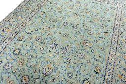 Backside of handmade 2000s Kashan rug showing knot structure and weave density