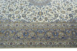 Corner detail of 2000s Kashan rug showing border pattern and Cork pile