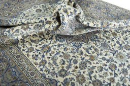 Surface texture of 2000s Kashan rug with natural Cork and intricate pattern